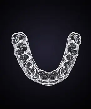 suresmile aligner against a dark background