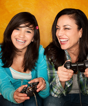 mother and daughter playing video games